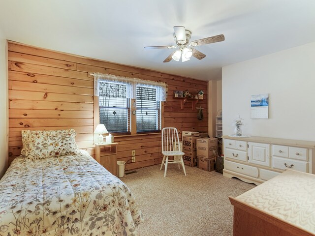 102 Fred Catlin Rd, Owego, NY 13827 - bedroom with wooden walls, carpet, and a ceiling fan