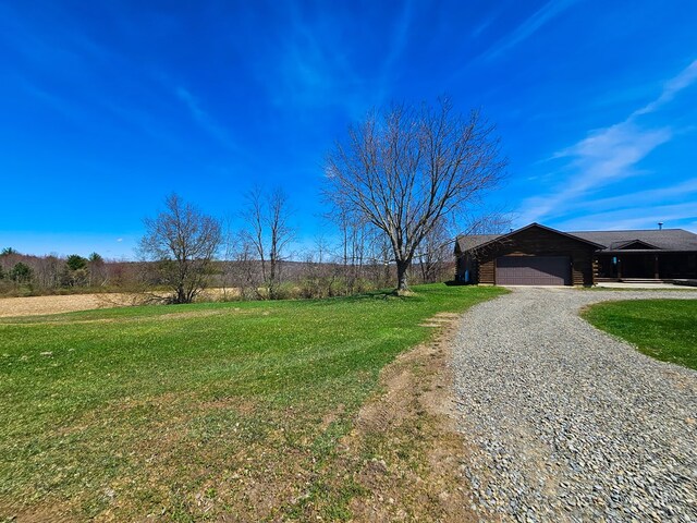 102 Fred Catlin Rd, Owego, NY 13827 - exterior space with gravel driveway and a garage