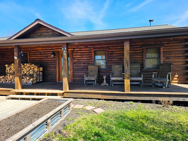 102 Fred Catlin Rd, Owego, NY 13827 - back of property featuring log exterior and a porch