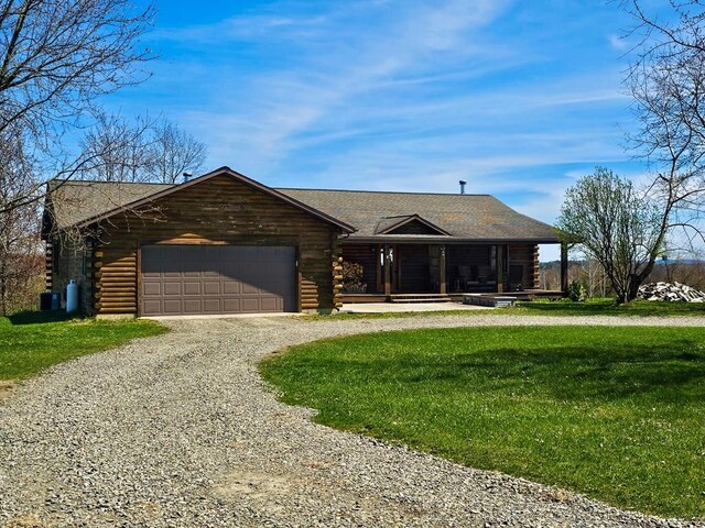 102 Fred Catlin Rd, Owego, NY 13827 - cabin with an attached garage, driveway, and log siding