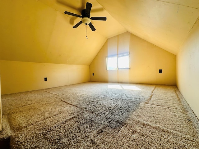 additional living space with carpet, ceiling fan, and vaulted ceiling