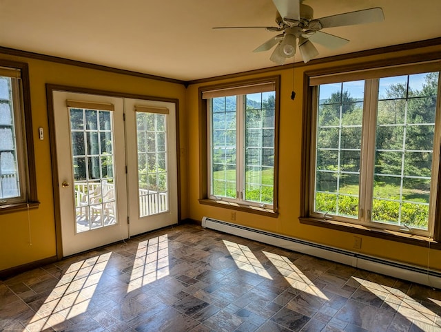 interior space with a baseboard heating unit and ceiling fan