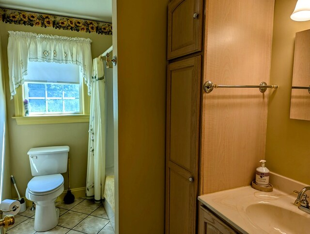 full bathroom featuring shower / bath combination with curtain, vanity, toilet, and tile patterned flooring