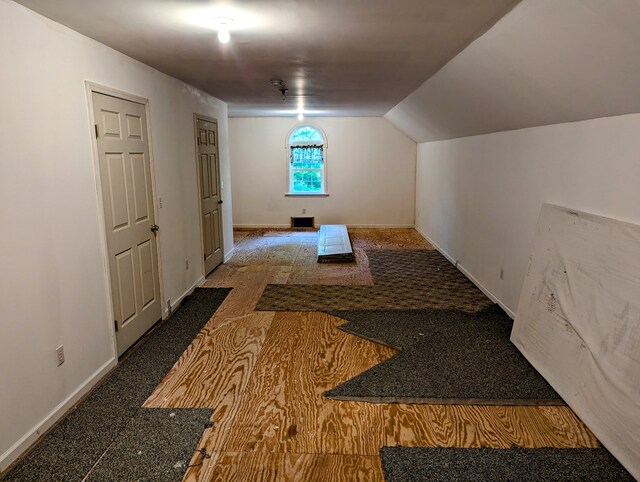 hallway with vaulted ceiling