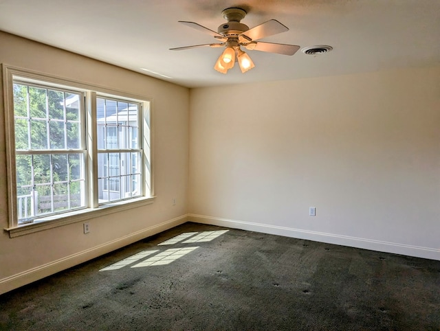 carpeted empty room with ceiling fan