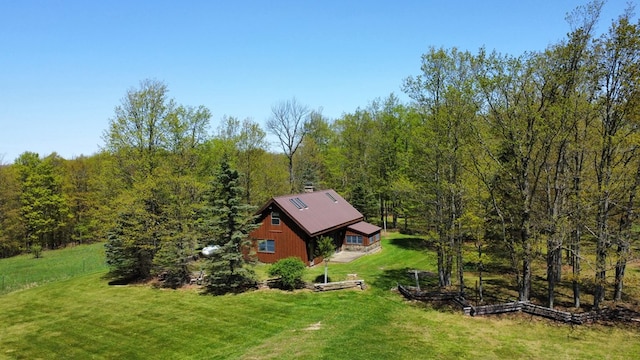 view from above of property featuring a heavily wooded area