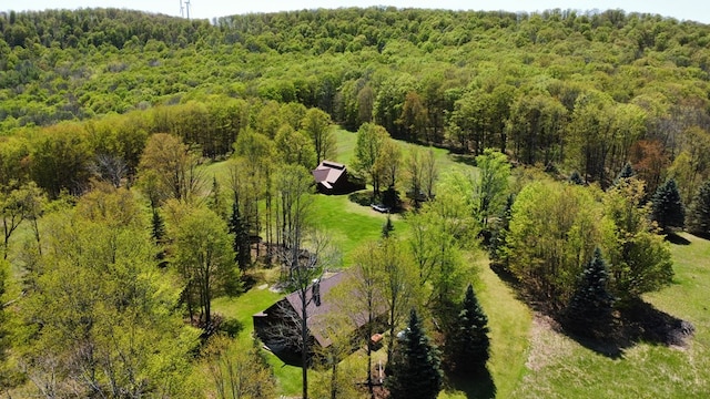 view from above of property featuring a heavily wooded area