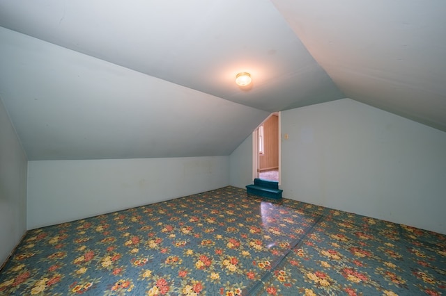 bonus room featuring vaulted ceiling