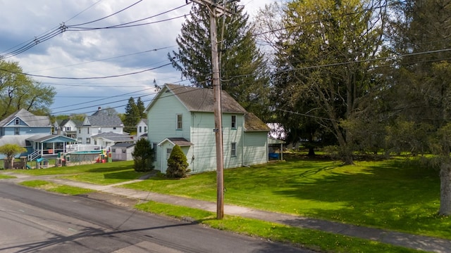 view of front of home featuring a front yard and a residential view