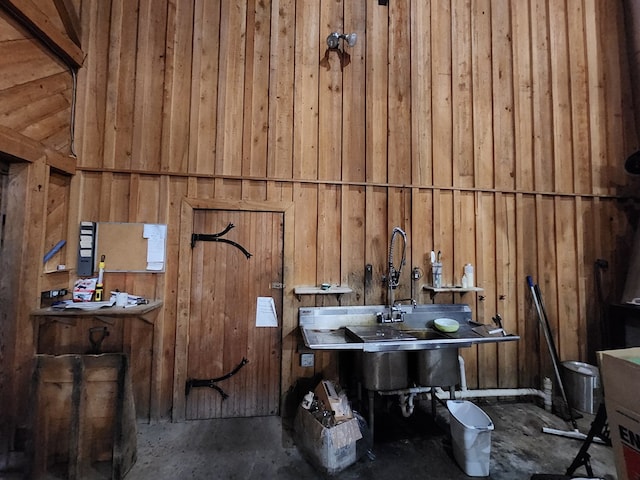 bathroom with wood walls