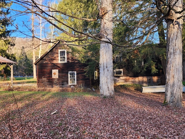 view of side of home with a mountain view