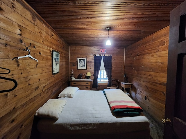 unfurnished bedroom with wooden ceiling and wooden walls