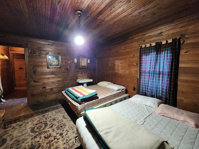 bedroom with wooden ceiling and wooden walls