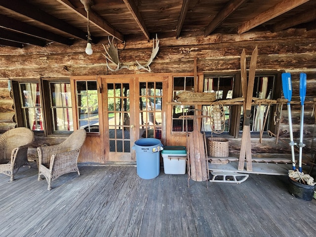 misc room with beam ceiling and dark hardwood / wood-style floors