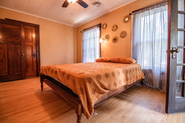 818 W Water St, Elmira, NY 14905 - bedroom with crown molding, light wood-type flooring, and ceiling fan