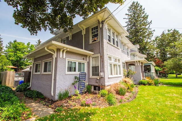 818 W Water St, Elmira, NY 14905 - view of home's exterior featuring stucco siding