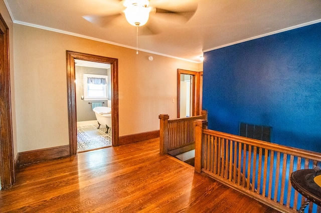 818 W Water St, Elmira, NY 14905 - hall with an upstairs landing, wood finished floors, and ornamental molding
