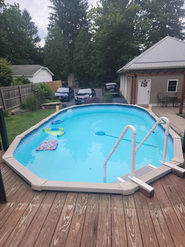 818 W Water St, Elmira, NY 14905 - view of swimming pool featuring a deck and view of scattered trees