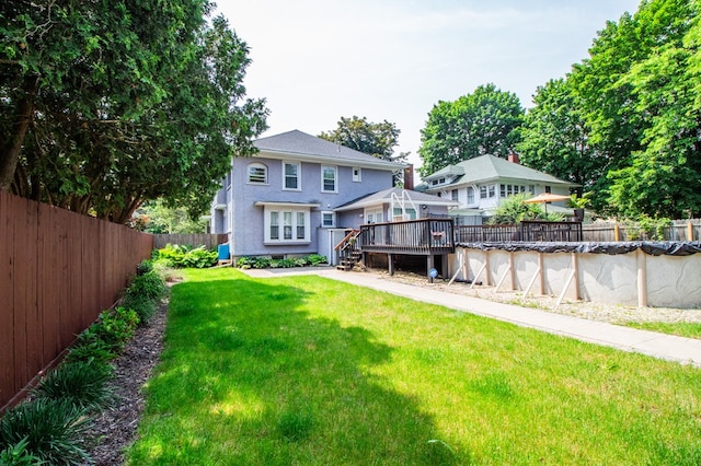 818 W Water St, Elmira, NY 14905 - back of house with a wooden deck, a fenced backyard, and stucco siding