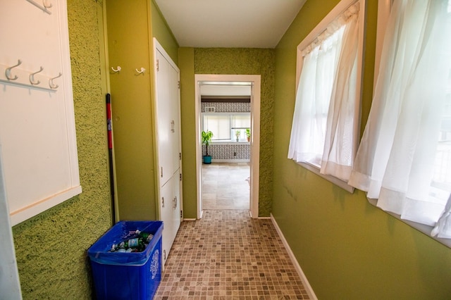 818 W Water St, Elmira, NY 14905 - hall with baseboards and tile patterned floors