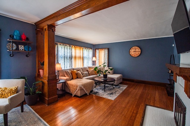 818 W Water St, Elmira, NY 14905 - living area with a fireplace, wood finished floors, and crown molding