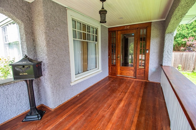 818 W Water St, Elmira, NY 14905 - property entrance with stucco siding and a porch