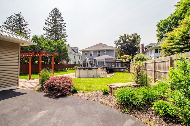 818 W Water St, Elmira, NY 14905 - fenced backyard with a pergola, a wooden deck, and a residential view