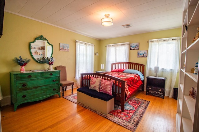 818 W Water St, Elmira, NY 14905 - bedroom with hardwood / wood-style floors and crown molding