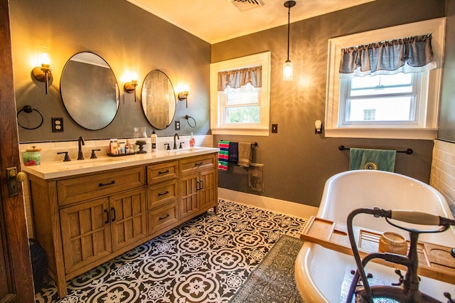 818 W Water St, Elmira, NY 14905 - full bathroom with a freestanding bath, double vanity, and crown molding