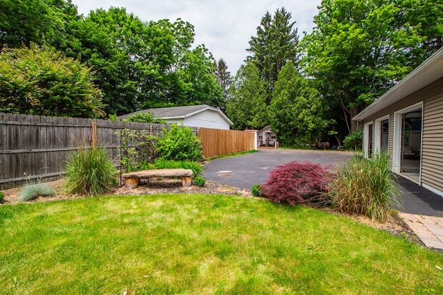 818 W Water St, Elmira, NY 14905 - view of yard featuring asphalt driveway