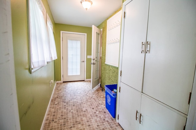 818 W Water St, Elmira, NY 14905 - doorway to outside featuring baseboards
