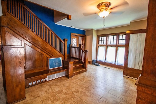 818 W Water St, Elmira, NY 14905 - staircase featuring ceiling fan, ornamental molding, and tile patterned flooring