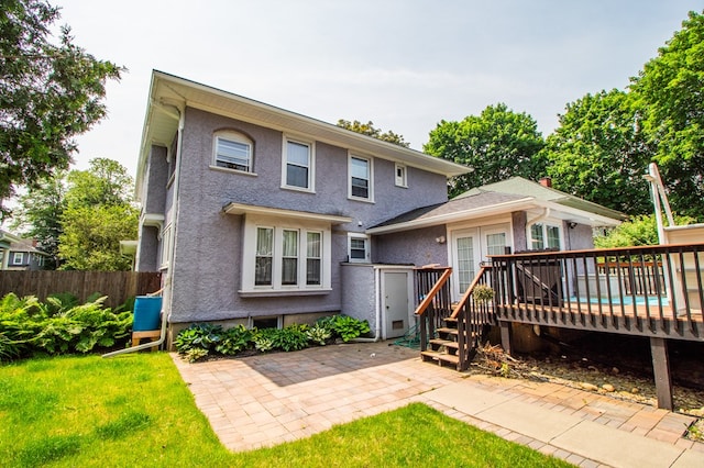 818 W Water St, Elmira, NY 14905 - back of house with a deck, stucco siding, and a patio area