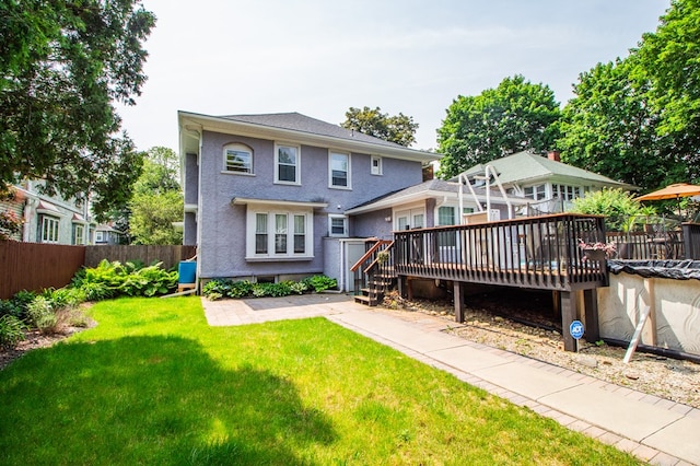 818 W Water St, Elmira, NY 14905 - rear view of property with a deck and stucco siding