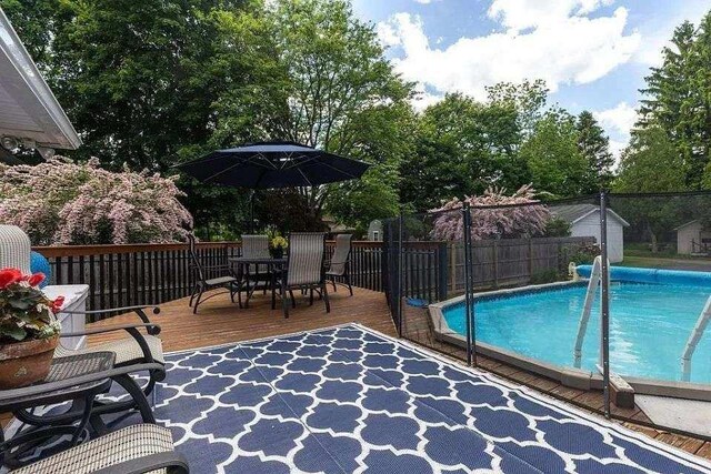 818 W Water St, Elmira, NY 14905 - view of swimming pool with a deck and outdoor dining space