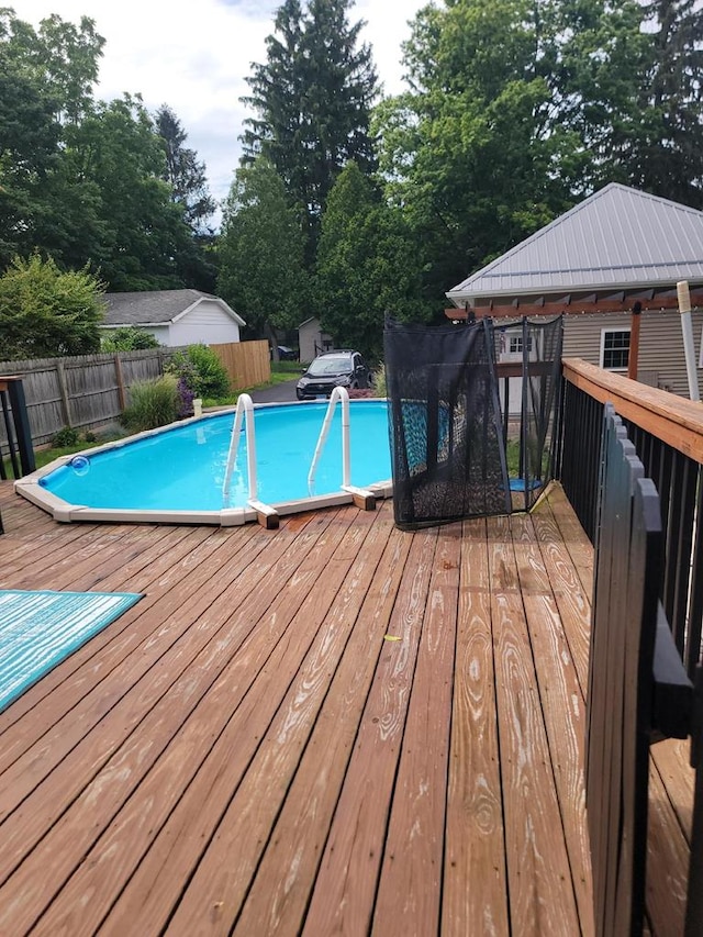 818 W Water St, Elmira, NY 14905 - view of swimming pool with a wooden deck and view of scattered trees