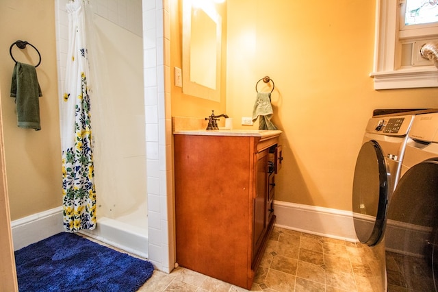 818 W Water St, Elmira, NY 14905 - bathroom featuring vanity, shower / bath combo with shower curtain, and washer / dryer