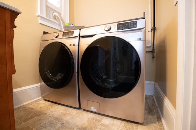 818 W Water St, Elmira, NY 14905 - laundry area featuring separate washer and dryer and baseboards
