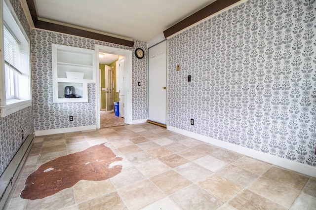 818 W Water St, Elmira, NY 14905 - empty room featuring a baseboard radiator and wallpapered walls