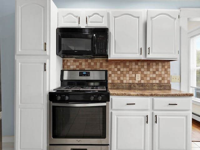 29 Cadwell Ave, Waverly, NY 14892 - kitchen with black microwave, stainless steel gas range oven, backsplash, and white cabinets