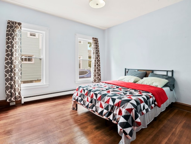 29 Cadwell Ave, Waverly, NY 14892 - bedroom featuring baseboard heating, hardwood / wood-style flooring, and baseboards