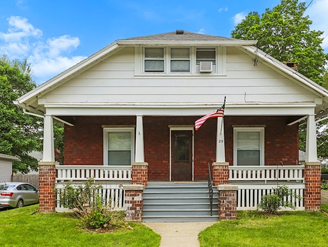 29 Cadwell Ave, Waverly, NY 14892 - bungalow-style home featuring covered porch and brick siding