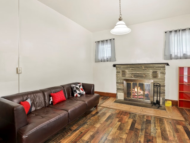 29 Cadwell Ave, Waverly, NY 14892 - living area featuring a stone fireplace, baseboards, wood finished floors, and lofted ceiling