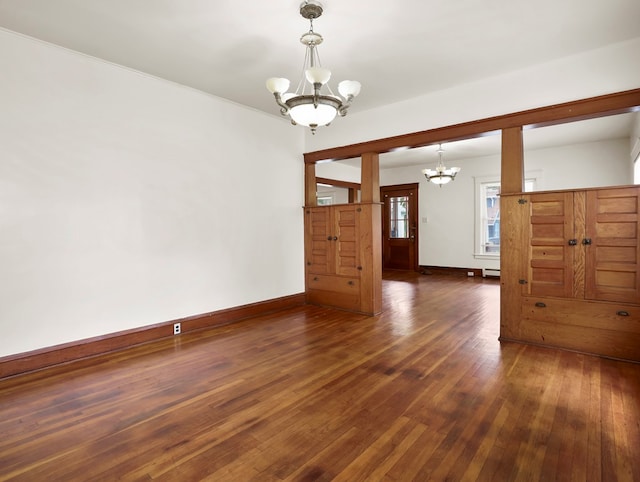 29 Cadwell Ave, Waverly, NY 14892 - unfurnished room featuring a chandelier, baseboards, and hardwood / wood-style flooring