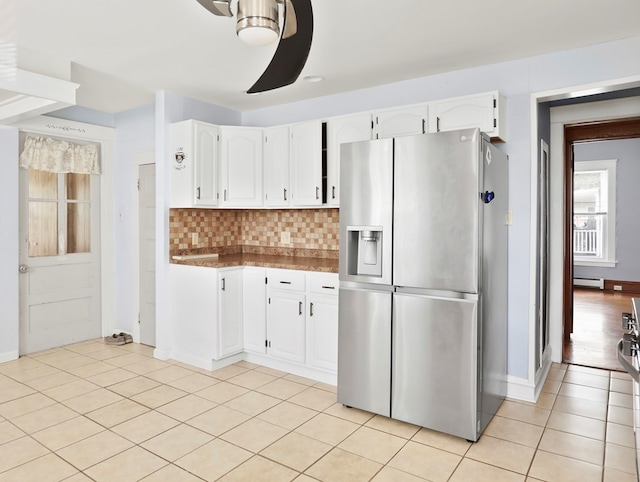 29 Cadwell Ave, Waverly, NY 14892 - kitchen featuring stainless steel fridge, ceiling fan, white cabinets, and light tile patterned floors