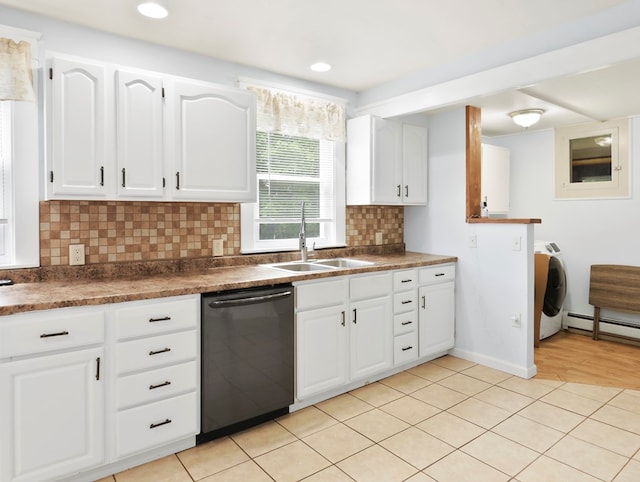 29 Cadwell Ave, Waverly, NY 14892 - kitchen with dishwashing machine, a sink, dark countertops, and tasteful backsplash