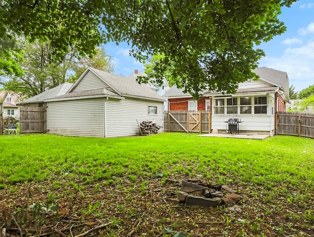 29 Cadwell Ave, Waverly, NY 14892 - back of house with a gate and a sunroom