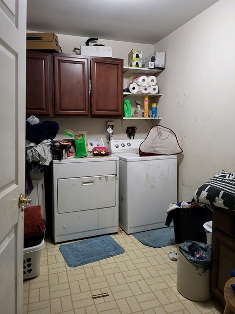 laundry area with cabinets and washing machine and dryer