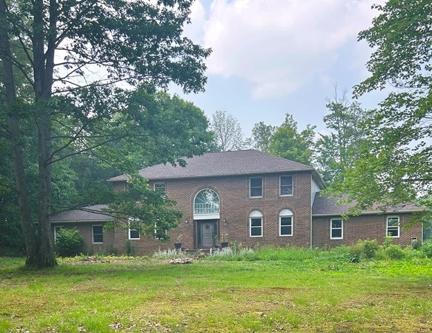 156 Hillcrest Dr, Coudersport, PA 16915 - kitchen with dark brown cabinetry, light tile patterned floors, a kitchen island, and white appliances