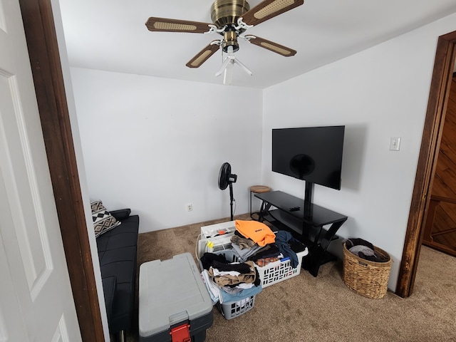 interior space with ceiling fan and carpet floors